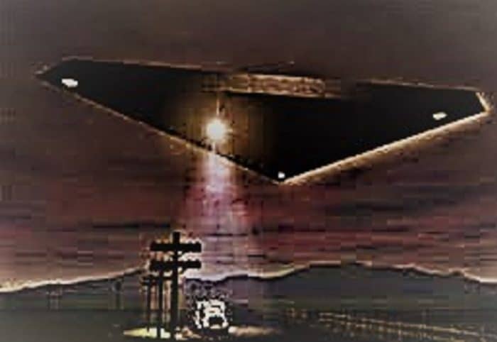 Depiction of a black triangle UFO shining a light on a truck