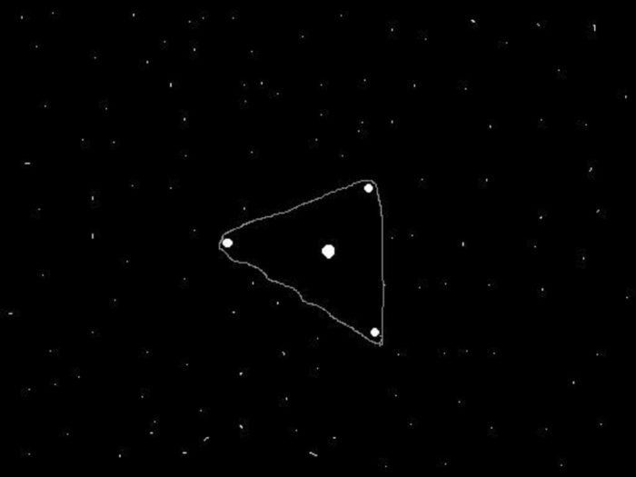 An artist's impression of a black triangle UFO against a night sky