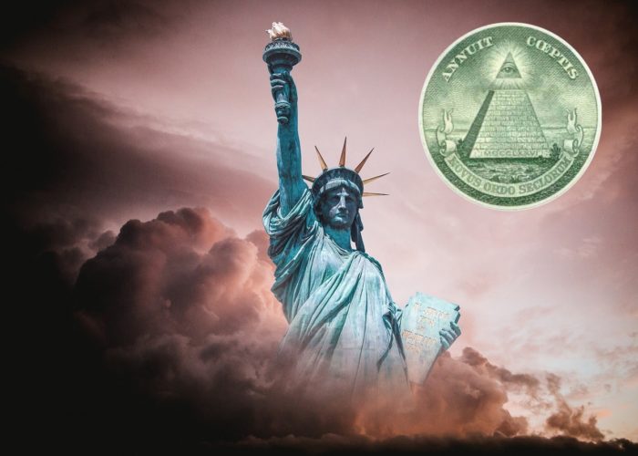 Picture of the Statue of Liberty with the all-seeing eye/pyramid seal behind it