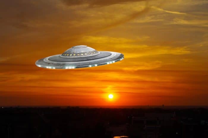 A superimposed UFO in a sunset sky