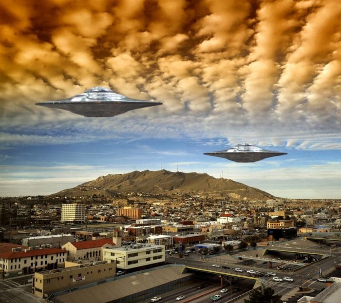 Two superimposed UFOs in a cloudy sky