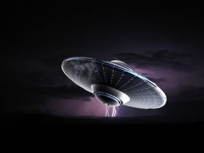 A depiction of a UFO against a lightning sky