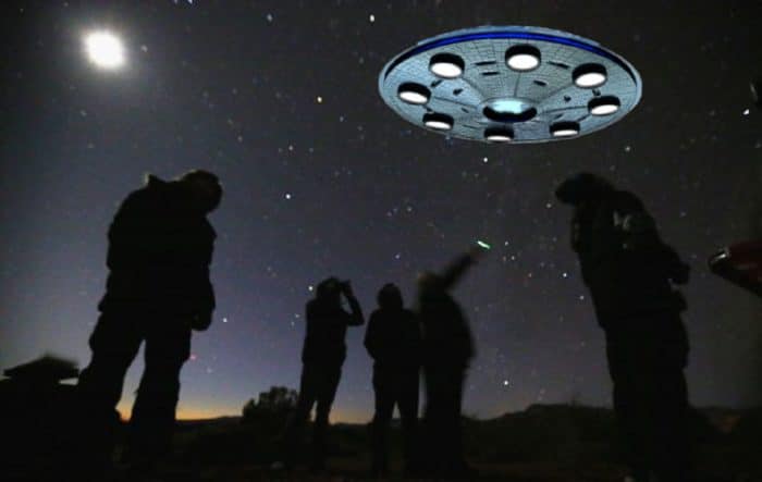 A depiction of a UFO in the sky with onlookers below