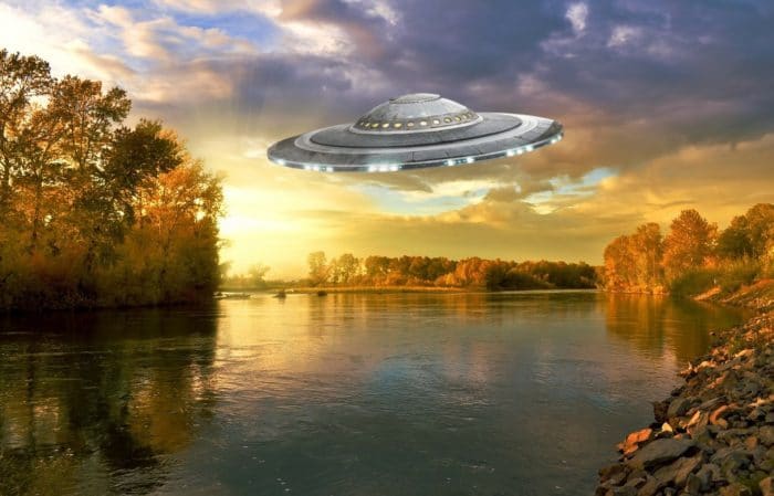 A depiction of a UFO over a river 