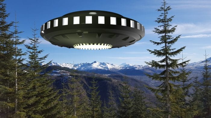 A superimposed UFO over trees in Washington State