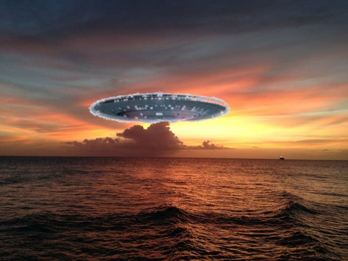 A depiction of a UFO over the water