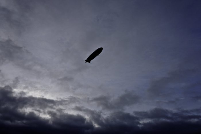 A depiction of an airship in a night sky