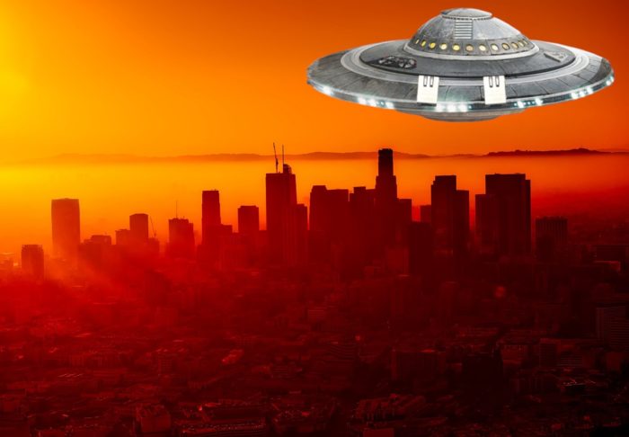 A UFO superimposed onto a city in California at sunset