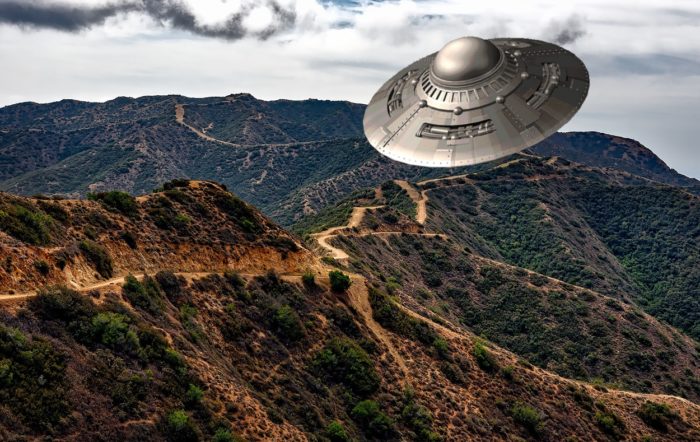 An image of a UFO over a mountain trail