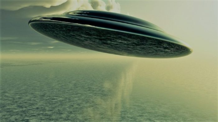 A depiction of a UFO over the water