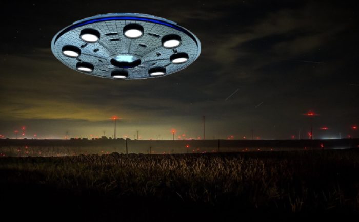 A superimposed UFO over a field 