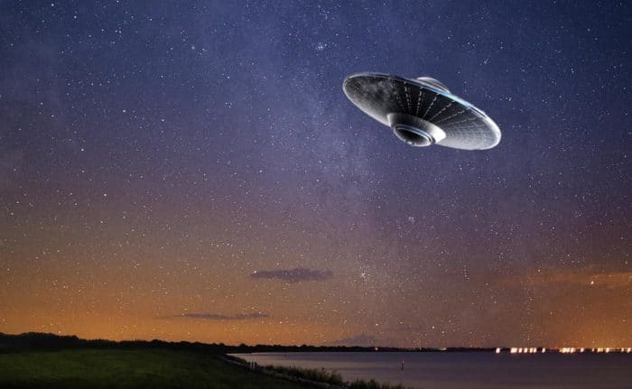 A superimposed UFO over a night sky