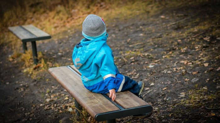 A picture of a child on a bench