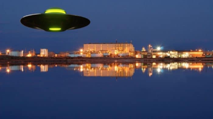 A depiction of a UFO over a lake and river 