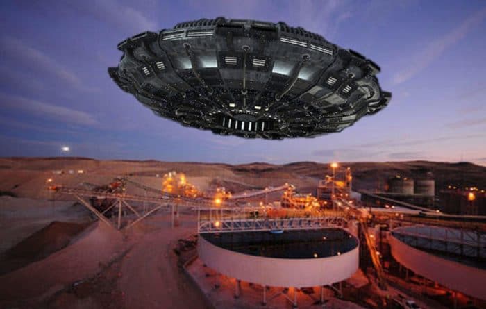 A depiction of a UFO over an Uranium mine