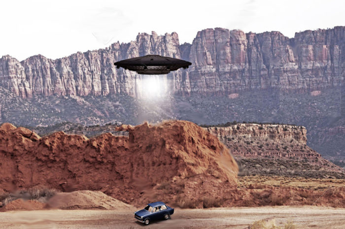 A depiction of a UFO hovering over a car 