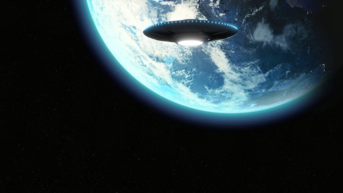 A depiction of a UFO approaching the Earth