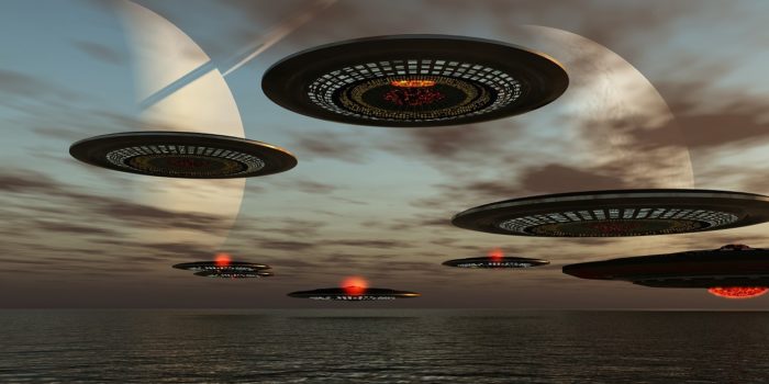 A depiction of a fleet of UFOs over the water