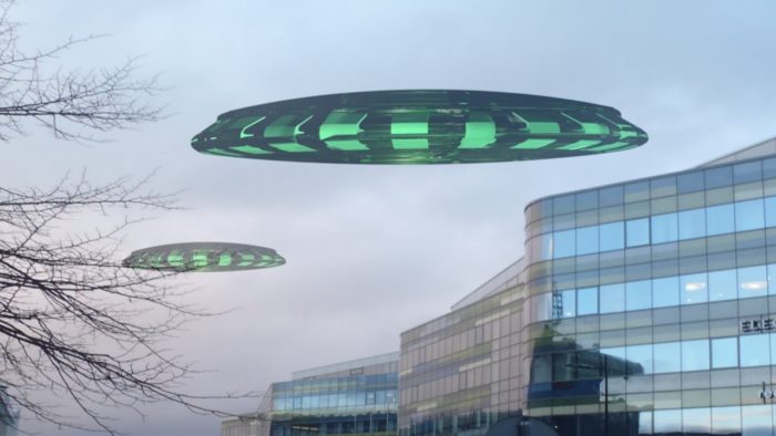 A depiction of a UFO hovering over a city building
