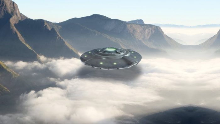 A depiction of a UFO flying over mountainous terrain