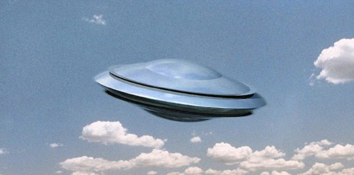 A depiction of a UFO in a cloudy sky
