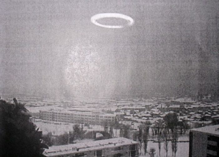 A strange ring shaped craft over a snowy city