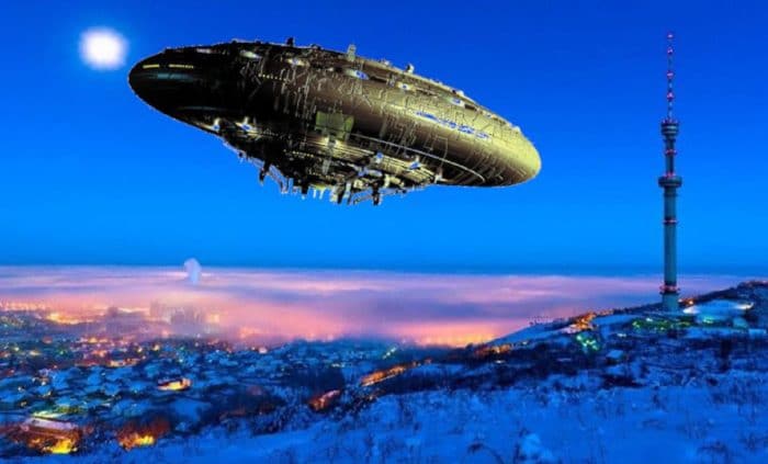 A superimposed UFO on a picture of mountain with snow at night
