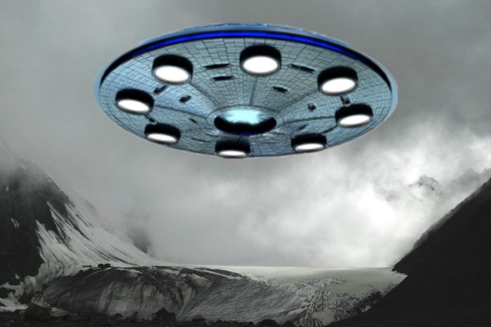 A superimposed UFO over a snowy mountain 
