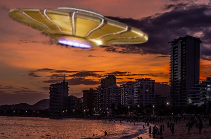 A superimposed UFO over a city shoreline at night