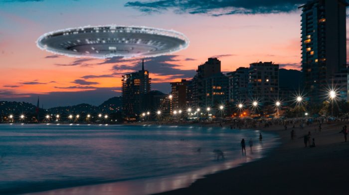 A superimposed UFO over a beach at night