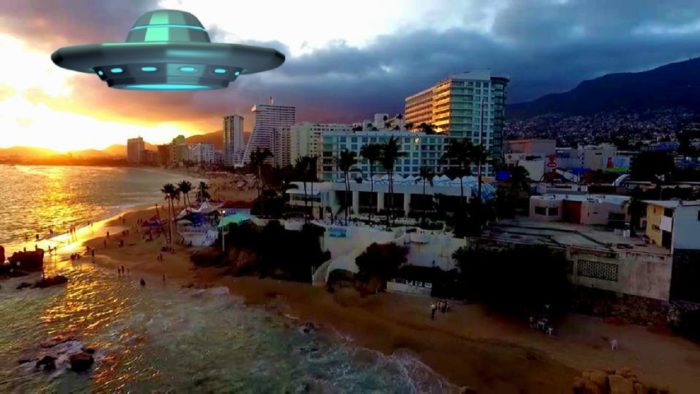 A superimposed UFO over beachside hotels at night