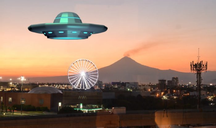 A superimposed UFO over a Mexican fairground at sunset