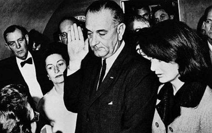 Lyndon Johnson being sworn in as President following Kennedy's assassination