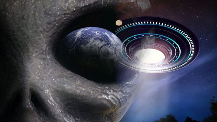 An image of an aliens face with the planet Earth in its eye