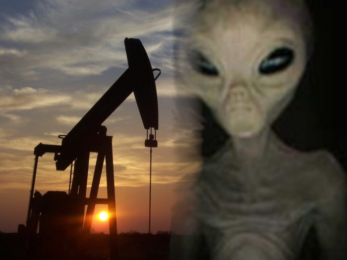 A blended picture of an oil drill with a grey alien