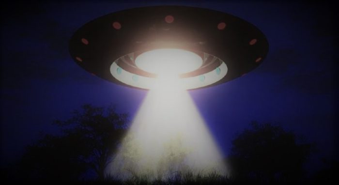 A depiction of a UFO with a light beam coming from underneath