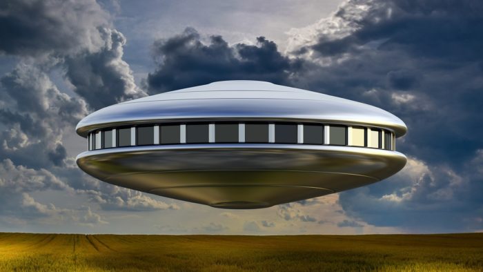 An image of a low-hovering shiny UFO