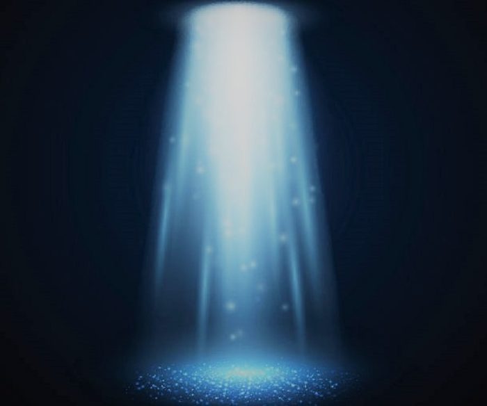 A depiction of a light beam coming from an unseen UFO