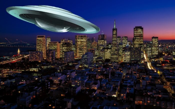 A UFO superimposed onto a night scene of downtown San Francisco