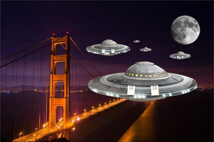 Several UFOs superimposed onto a night picture of the Golden Gate Bridge