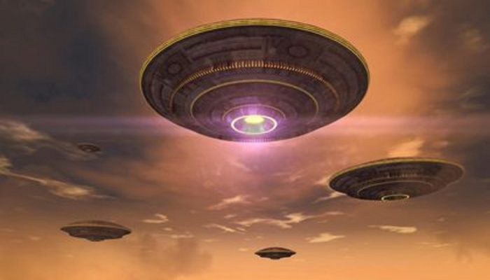 A depiction of four UFOs hovering in an evening sky