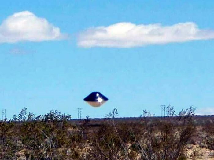 A picture claiming to show a real UFO hovering just above the ground