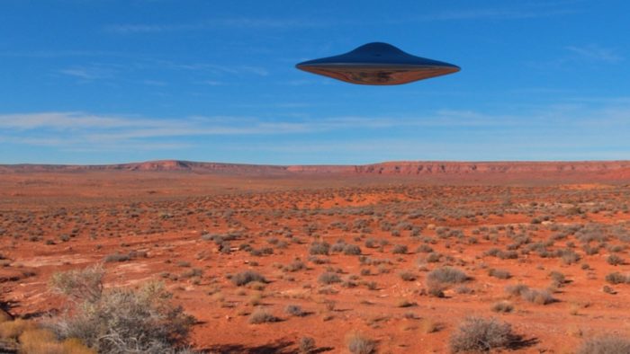 A superimposed UFO over a desert