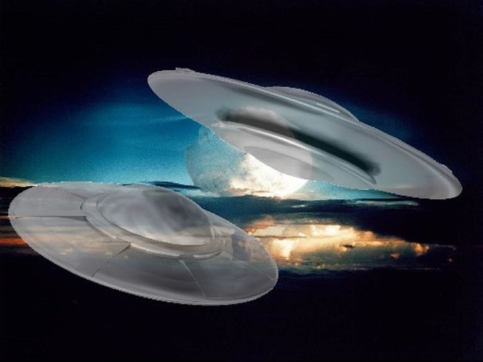 Two superimposed UFOs over an image of a nuclear mushroom cloud