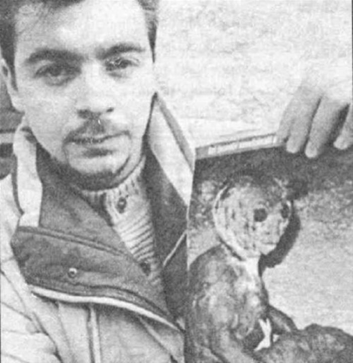 Filiberto Caponi holding one of his pictures 