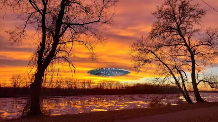 A UFO superimposed on to a picture of a lake at dawn