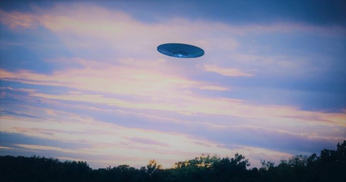 An image of a UFO in a cloudy early morning sky
