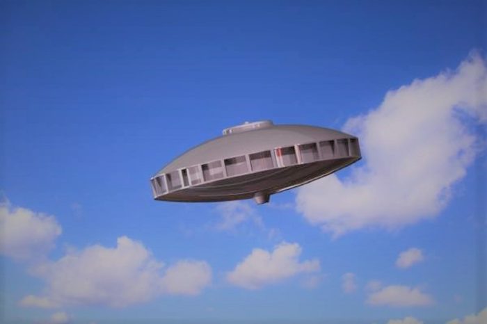 An image of a typical UFO in a bright daytime sky