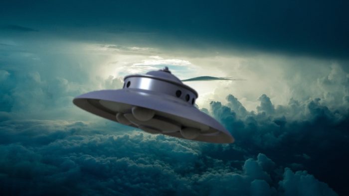 An image of a typical 1950 UFO in a cloudy sky
