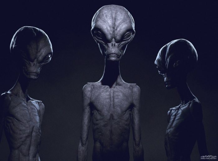 A depiction of three grey aliens 